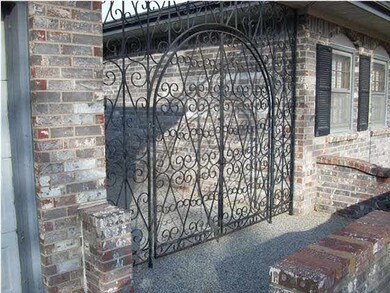Front gated area before you get to the front door.