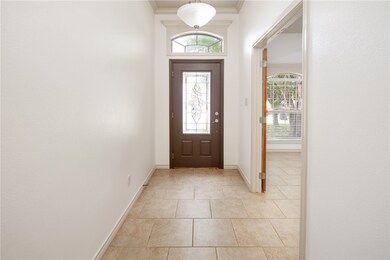 Entryway featuring light tile patterned floors and