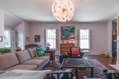Living room featuring pine  wood flooring and a he