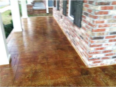 Inviting covered front porch with stained and scor