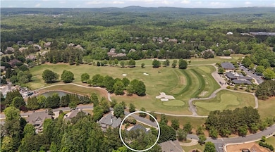 Aerial view showing location to golf course.