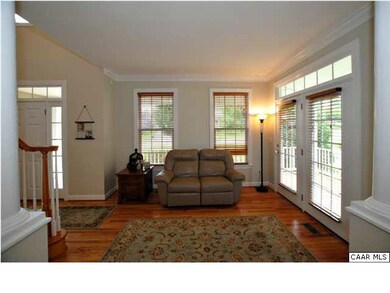 To the left of the foyer is the living room.
