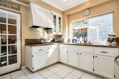 Remodeled Kitchen offers White Cabinetry with Shak