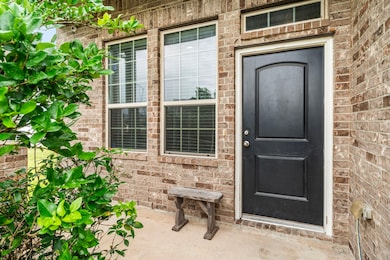Charming brick exterior with a welcoming front ent