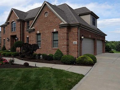 Exterior Front. 4 car garage with (2) 16 x8  garag