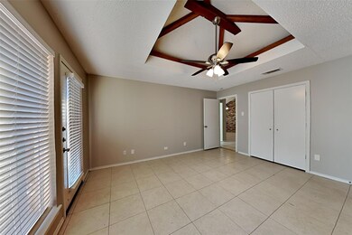 Unfurnished bedroom featuring ceiling fan, a textu