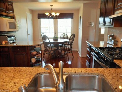 Kitchen and dining area, from dining room, through