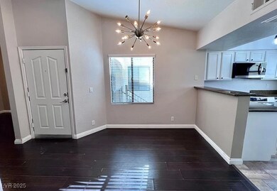 Unfurnished dining area with a chandelier and wood