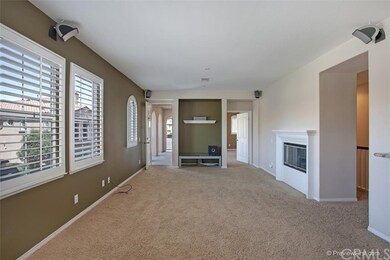 Volume ceilings, a wall of windows and a cozy fire