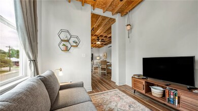 Living room featuring wood finished floors, basebo