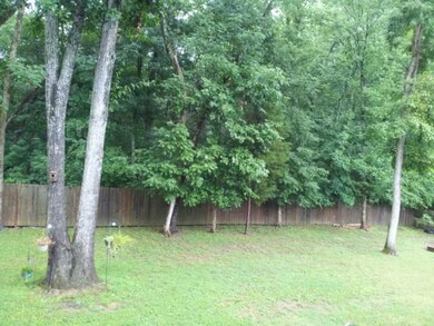 Notice the forest behind your home. Peace and quiet....