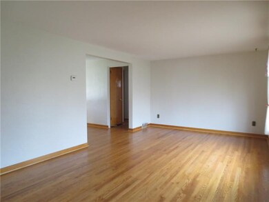 Very spacious living room with sparkling hardwood 