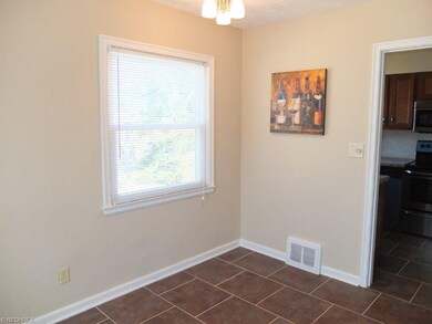 Dining area with tile floor.