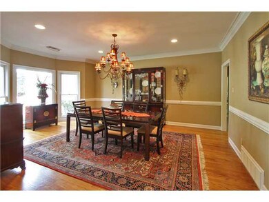 Dining room is large 19'x14' with beautiful wood f