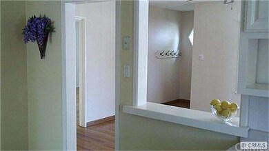 KITCHEN LOOKING INTO LIVING ROOM