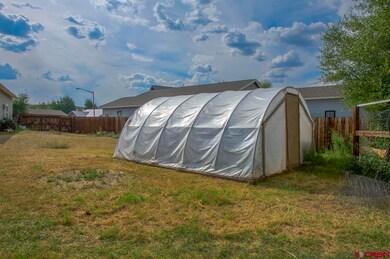 Green house, fenced back yard.