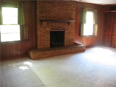 Large cozy den with massive fireplace & beautiful 