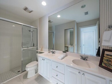 Master bath with dual sinks, walk-in shower and li