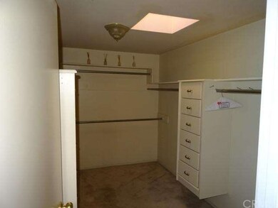 Large walk-in master closet with built-ins.