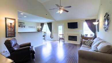 Spacious living room with fireplace! Hardwood floors! Vaulted ceiling! Look at the walkable floorplan here: http://bit.ly/24YFvnU