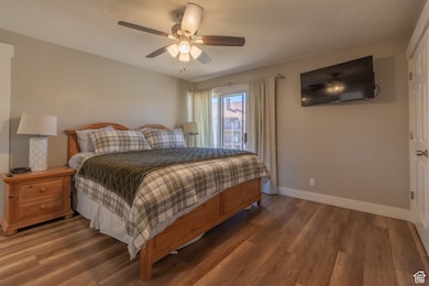 Bedroom with wood finished floors and ceiling fan