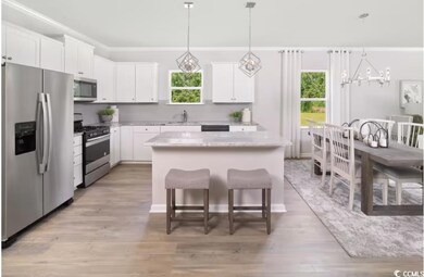 Kitchen with appliances with stainless steel finis