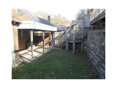Exterior Back. Rear covered porch plus a rear deck