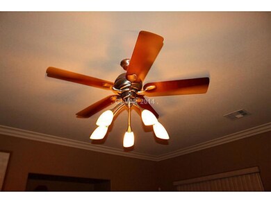 Property Photo. Ceiling Fan in every room. This fi