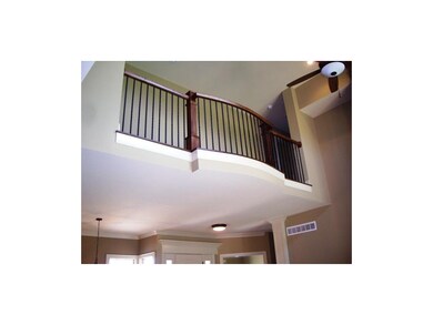 Upstairs hallway has an overlook into the great ro