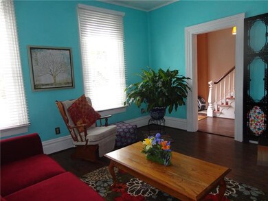 LIVING ROOM ACCESSING ENTRY HALL.