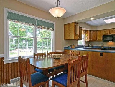 Breakfast. Enjoy the beautiful backyard view from the breakfast area.  Just to the left are the stairs leading up to the bonus area, a great place for kids to hang out and close enough to the kitchen to get refreshments.