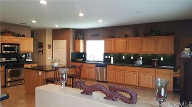 Beautiful upgraded kitchen featuring an island, gr