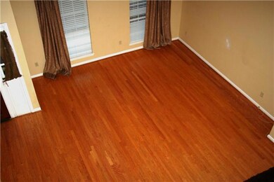 The living room has beautiful hardwood flooring!