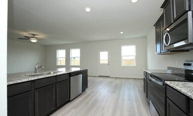 This incredible kitchen also features a breakfast bar and easy access to the dining area.