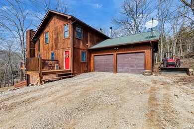 Three decks and a two car garage!  The tractor is 