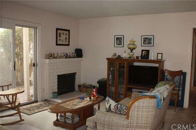 Living room faces private patio.