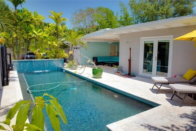 Front of house has waterfall pool and lounge