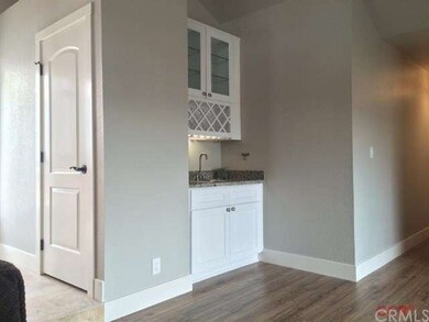 Wine rack and wet bar in the family room.