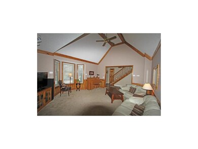 Living room with vaulted ceiling, bay window, fire