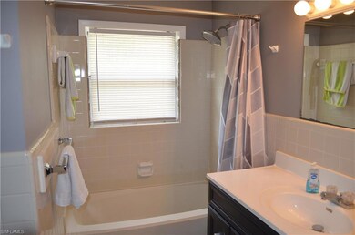 Bathroom featuring backsplash, oversized vanity, a