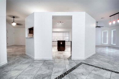 Front entry to kitchen - sides to both living areas