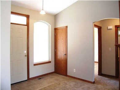 The entry features easy care ceramic tile flooring