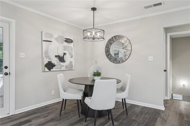 Dining space featuring wood finished floors, a cha