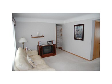 Living Room.    Spotless interior wtih newer carpe