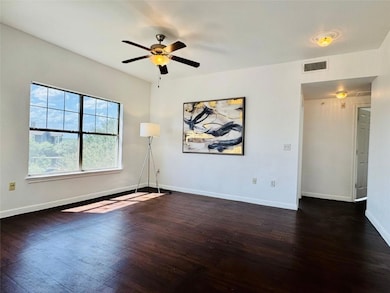Spare room featuring dark wood finished floors an