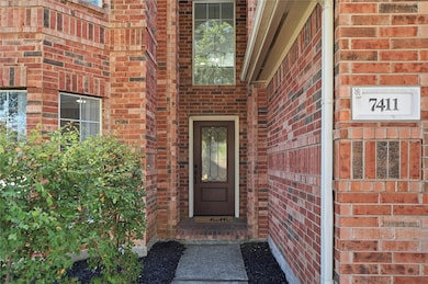 Front entry to 7411 Stonesfield Place. Built by Hampton Homes in 2003
