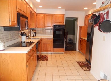 Beautifully updated kitchen with electric cooktop 