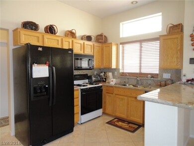 LIGHT AND BRIGHT KITCHEN WITH GRANIET COUNTER TOPS