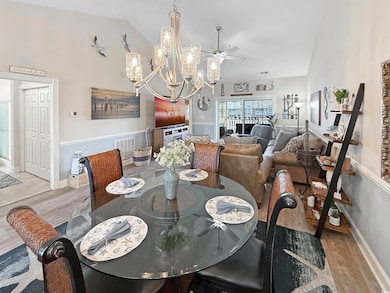 Dining room featuring an inviting chandelier, wood