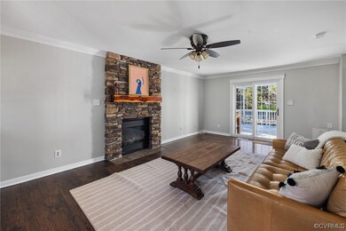 Living room featuring dark wood-type flooring, cei